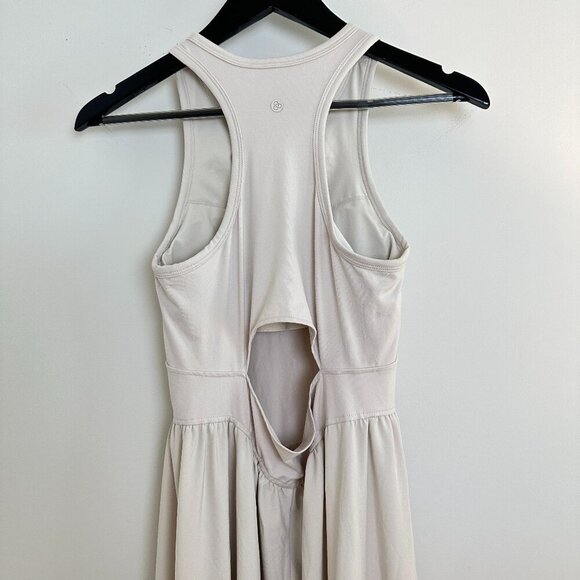 Elegant White Sleeveless Dress - Picture 8 of 16